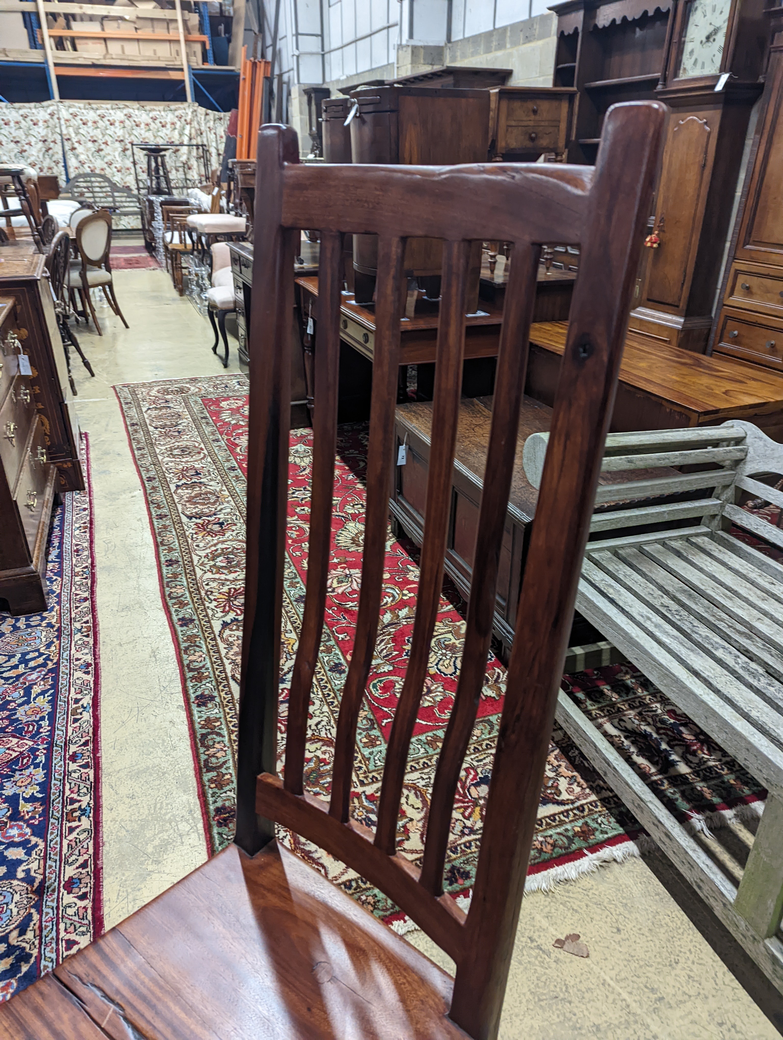 A South African distressed hardwood rectangular refectory dining table, length 200cm, depth 100cm, height 75cm and eight hardwood high back wood seat dining chairs